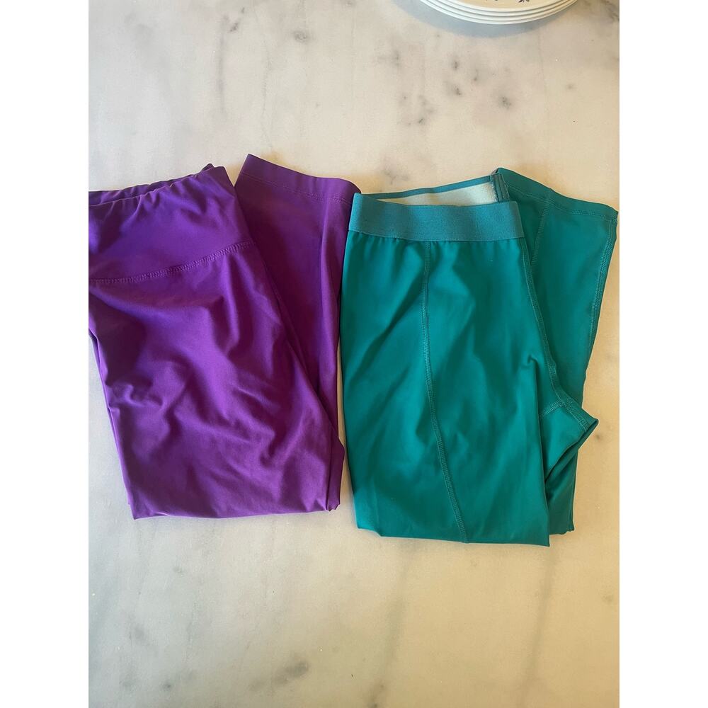 Two workout capri pants. Green FILA Small. Purple Bally Medium. Running. walk